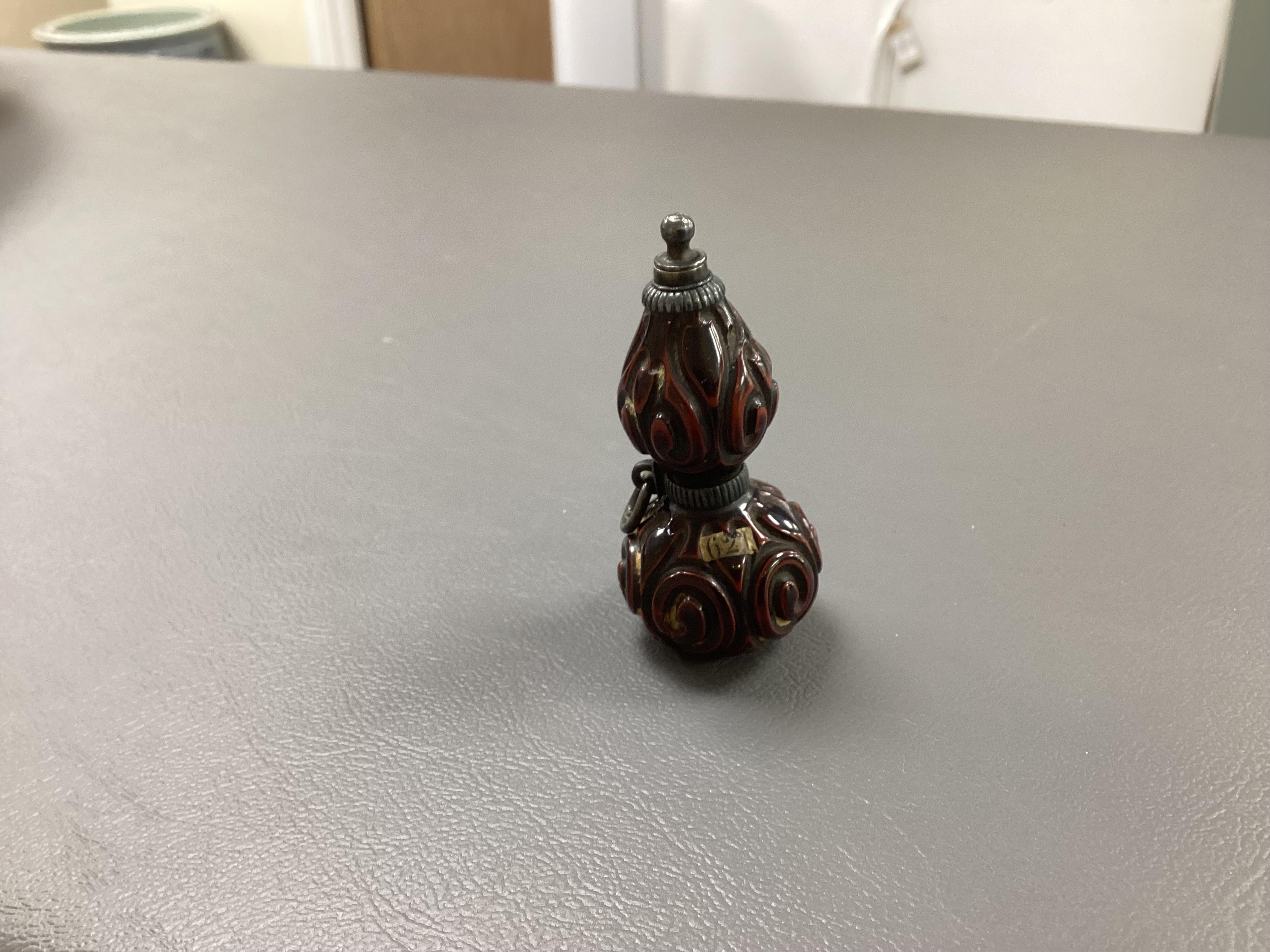 A Japanese guribori lacquer double gourd shaped netsuke, Edo period, late 18th/early 19th century